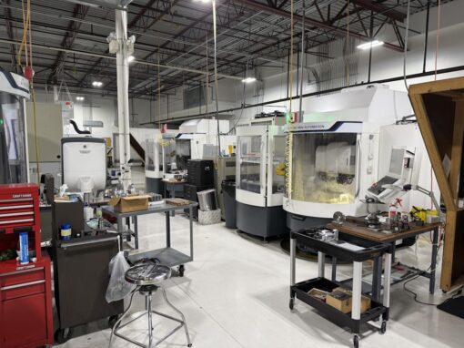 5-axis CNC machining center producing a complex part