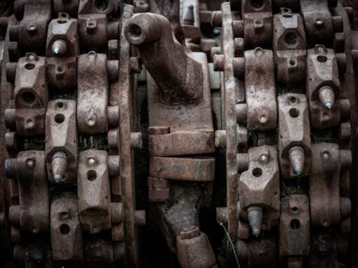 Metal component of an industrial mold with visible wear